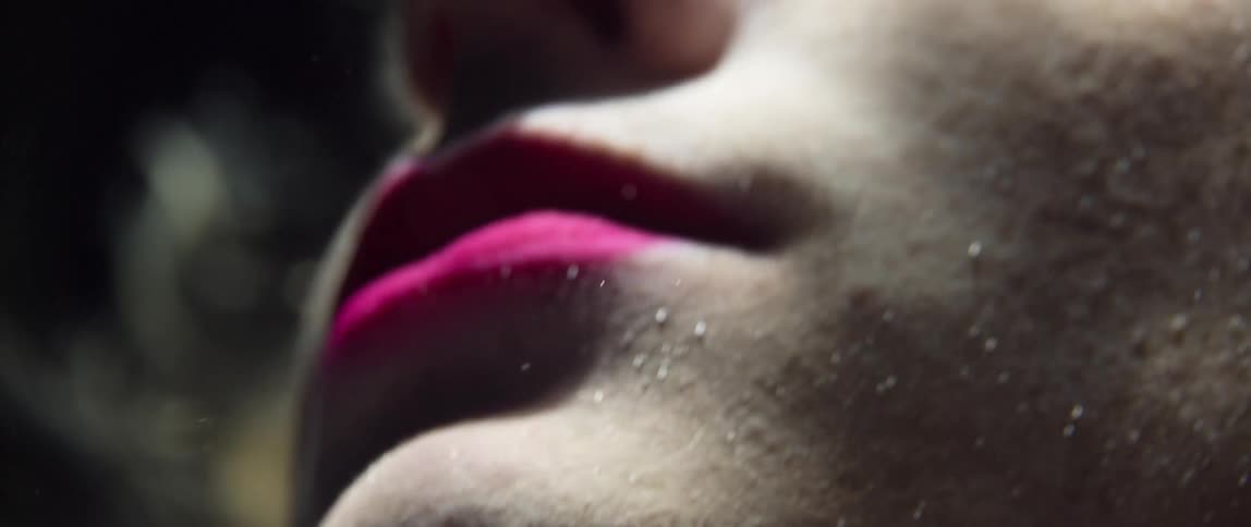 A woman underwater with her eyes open