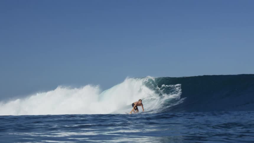 A person surfing a large wave