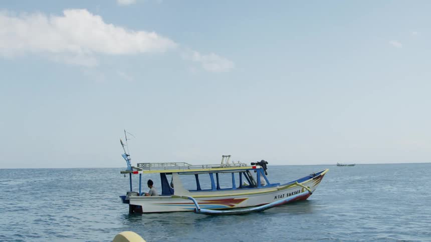People relaxing on a boat in the ocean