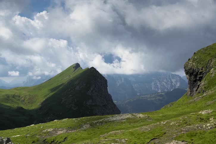 The clouds roll over the mountains