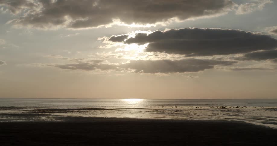 An ocean tide comes in on a beach