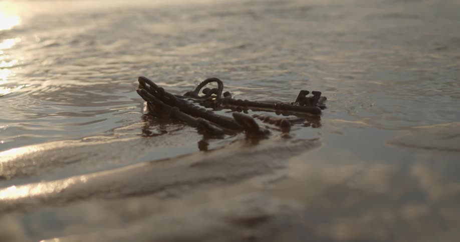 Old set of keys lying on the beach