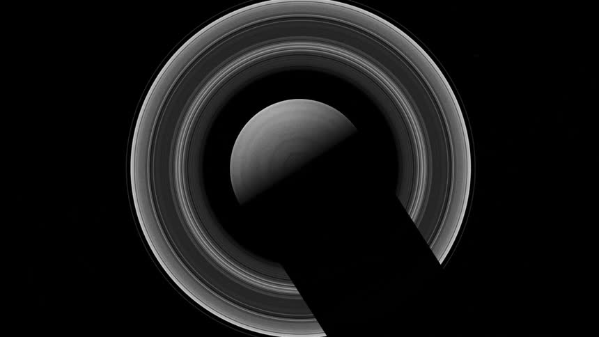 The planet saturn casts a large shadow over its ring system