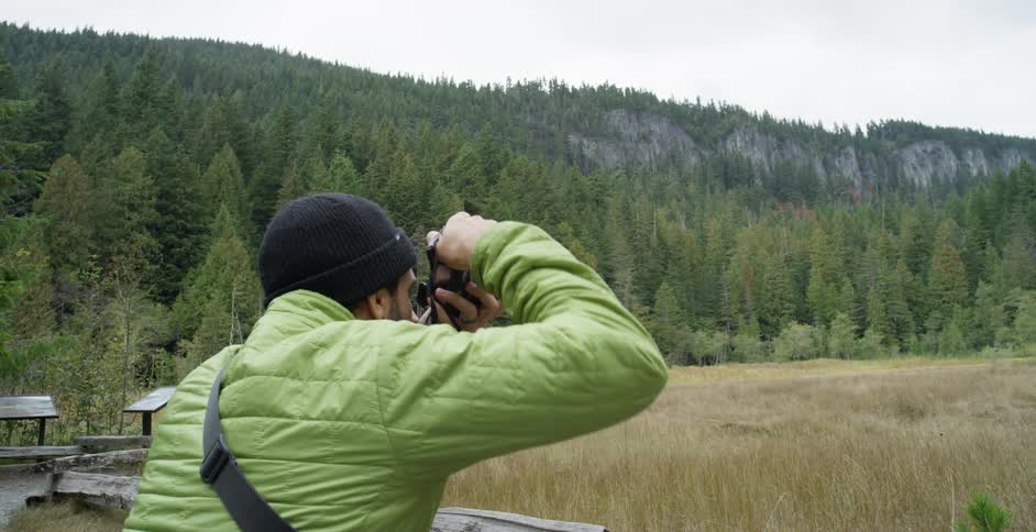 Photographer taking a nature shot out in the wilderness