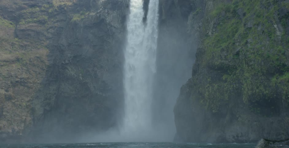 Waterfall falls from a high cliff