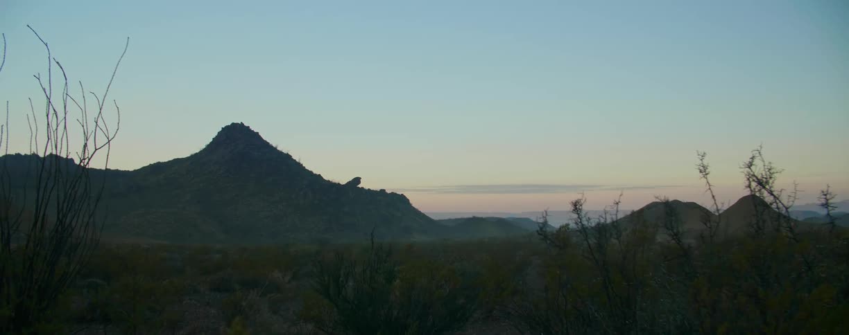 Mountains in a desert at sunset