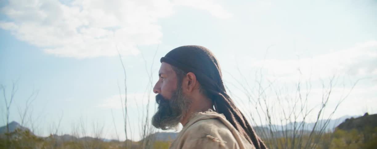 A man walking across the landscape