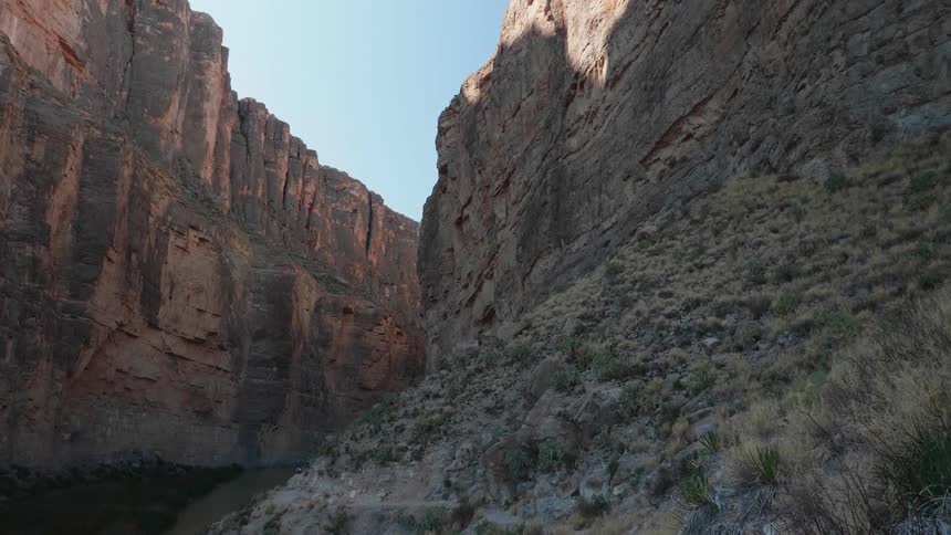 A deep canyon sits between two rocky crags