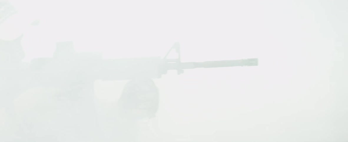 Fog covers a soldier holding a gun