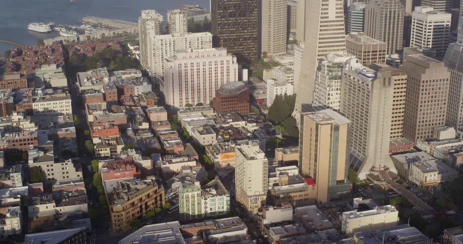 A downtown area and neighborhoods sit by a body of water