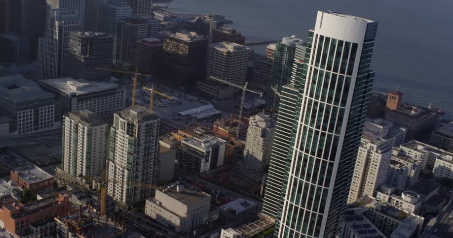Aerial view of a downtown area with tall buildings next to a river