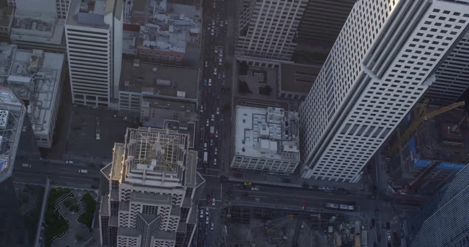 Aerial view of office buildings and cars driving in a downtown area