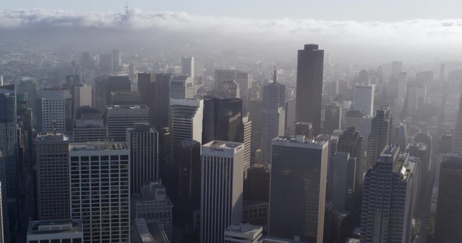 The fog is covering the tall buildings
