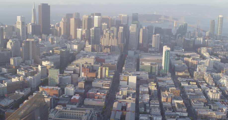 An aerial view of a city and skyline is displayed