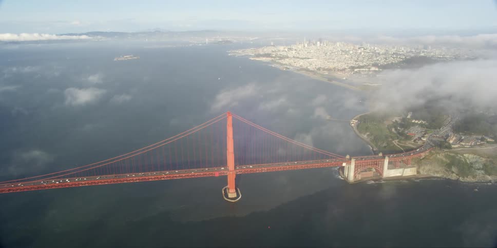 Aerial of small clouds above the golden gate bridge
