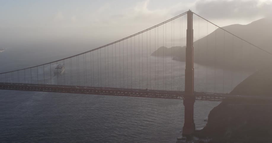 Aerial view of the golden gate bridge over the san francisco bay on a foggy day at sunset