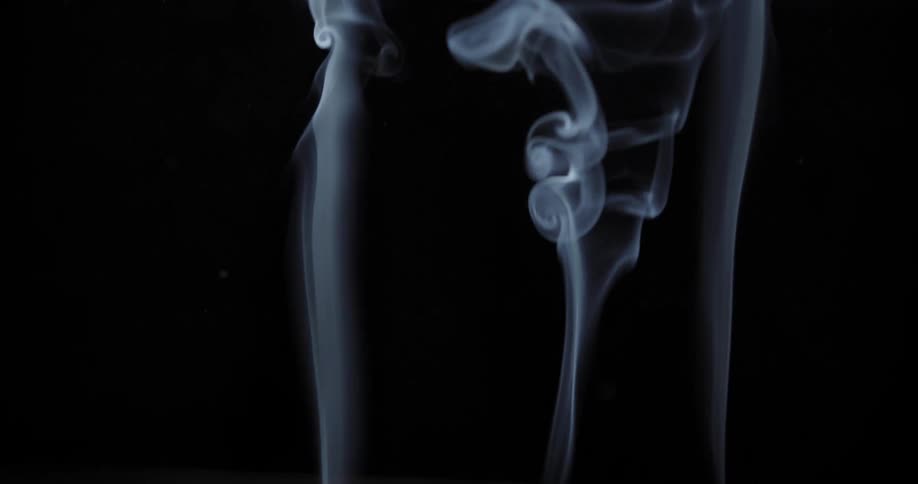 Three columns of white smoke on a black background