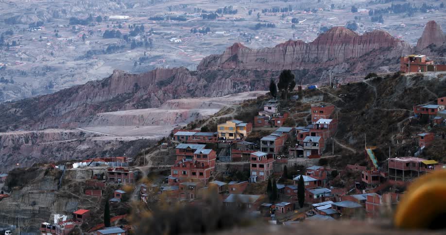 Houses built on a slope near mountains