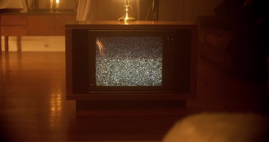 Static plays on a tube style television encased in wood