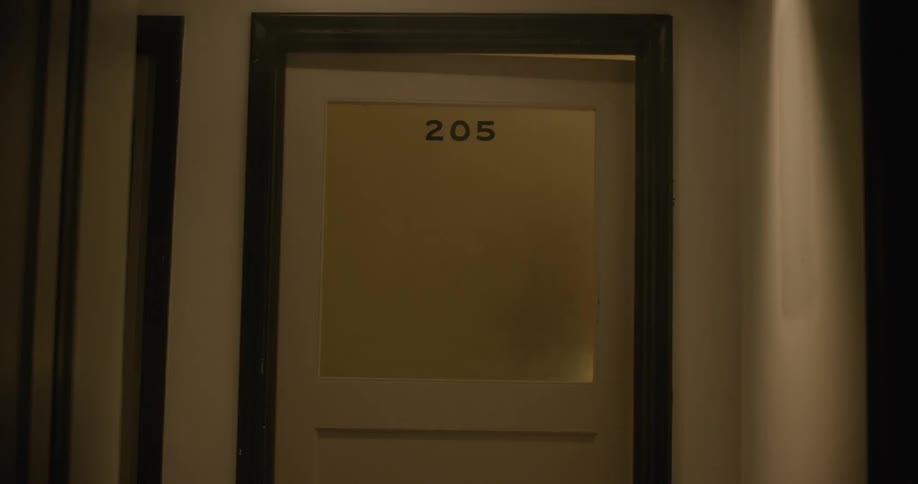The light flashes behind the door