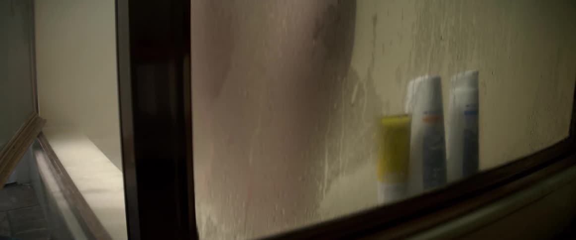 Unclothed male opens the door of the stand up shower and steam rolls out as he opens the door to step in then closes the door behind him