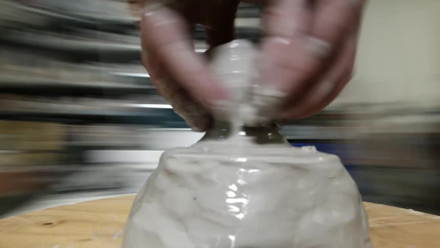 Time lapse of a sculptor working with clay