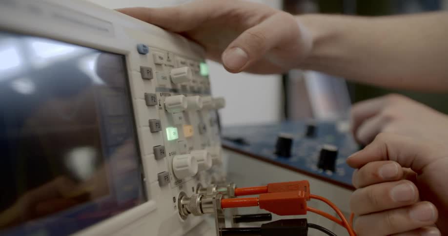 A person pushing buttons on medical equipment