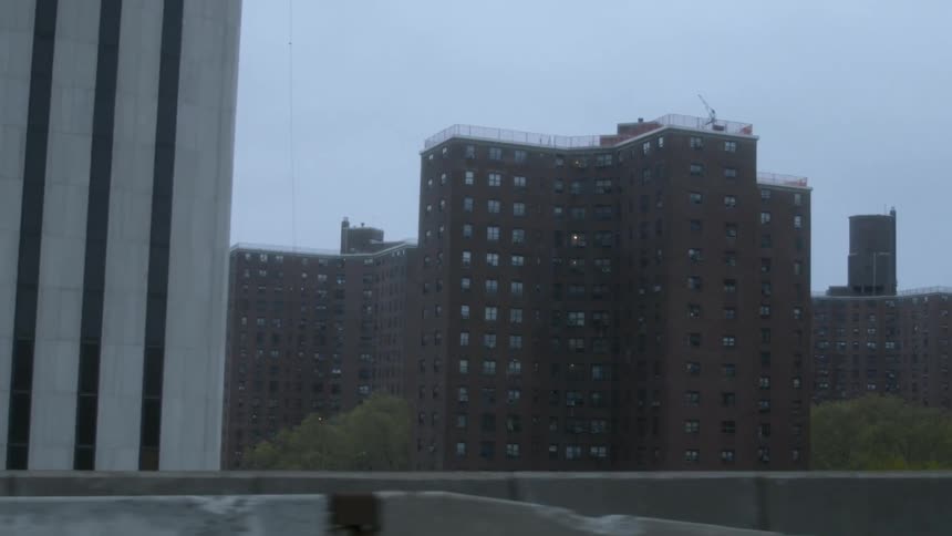The apartment buildings are in a block ahead