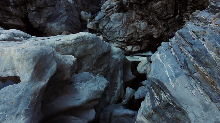 A stream runs through a canyon