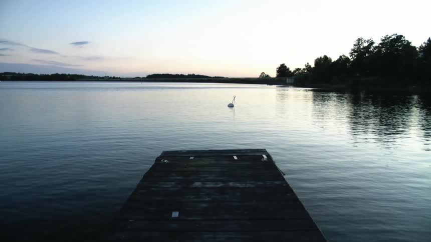 The end of a dock on a lake