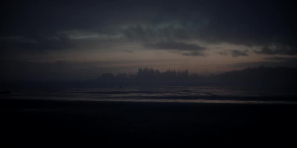 Landscape view of the beach and water at blue hour