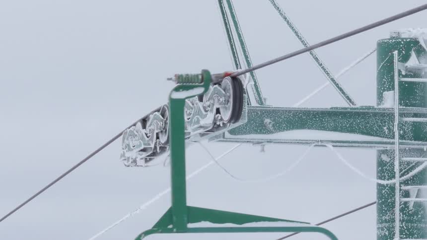Ski lift travels up the cable