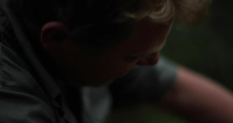 Man works with his hands outdoors