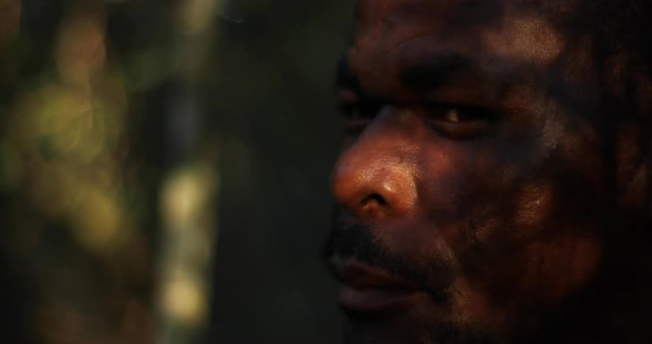 A man is looking around outside