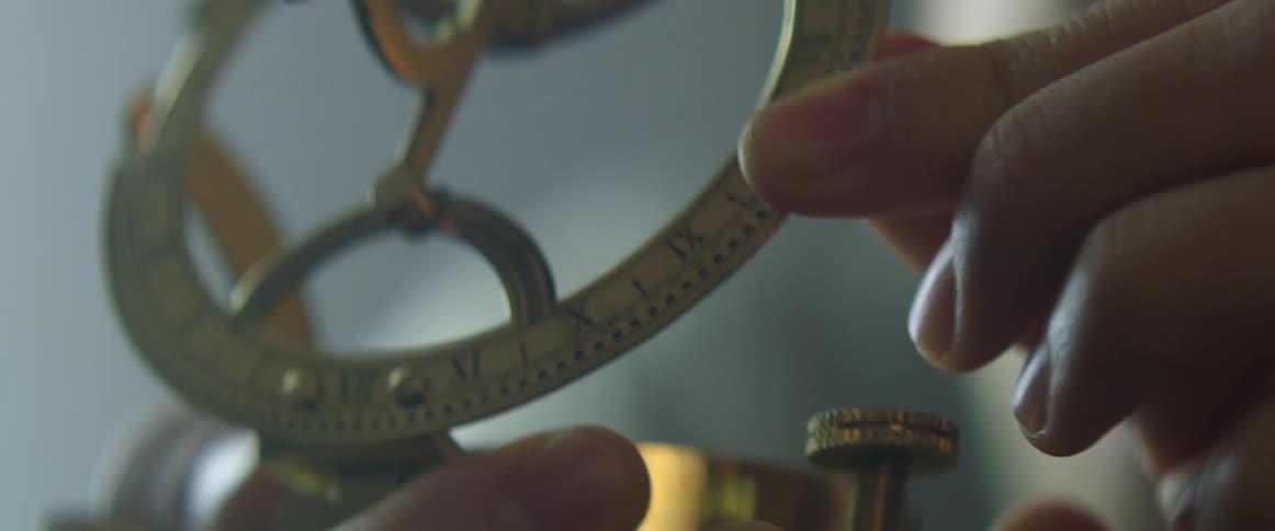 A person holding a compass