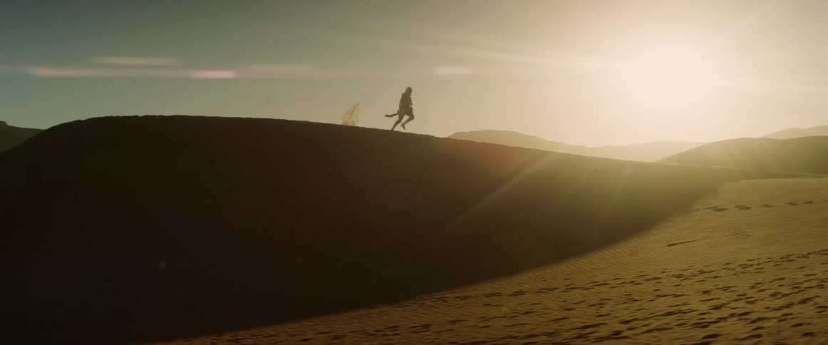 A person running across a hill