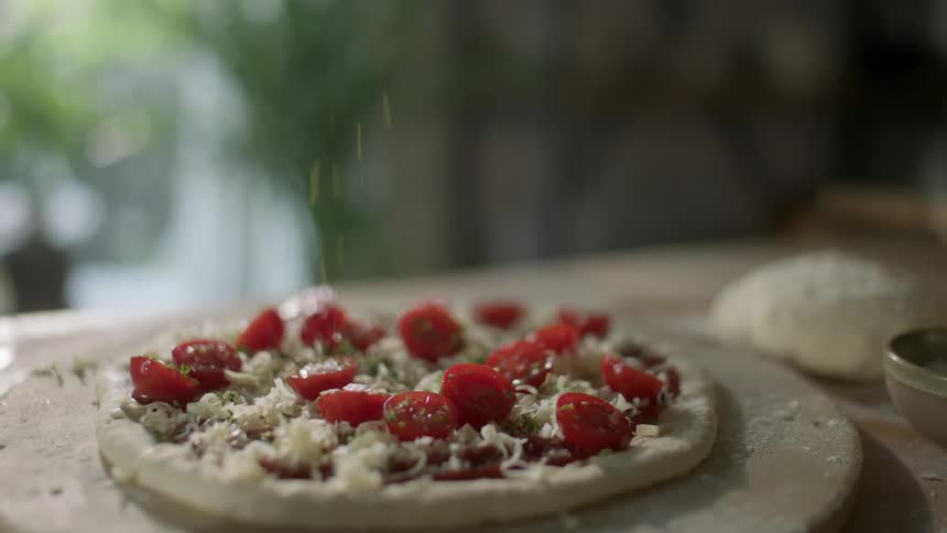Homemade pizza over a table in the kitchen