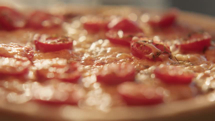 The cheese on the pizza bubbles