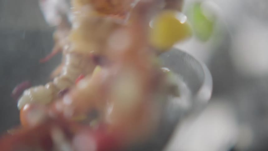 Food is flipped in the skillet