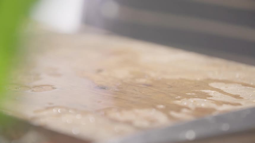 Wet vegetables falling onto a cutting board