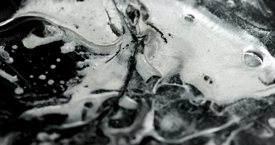 The liquid mixes together making foam