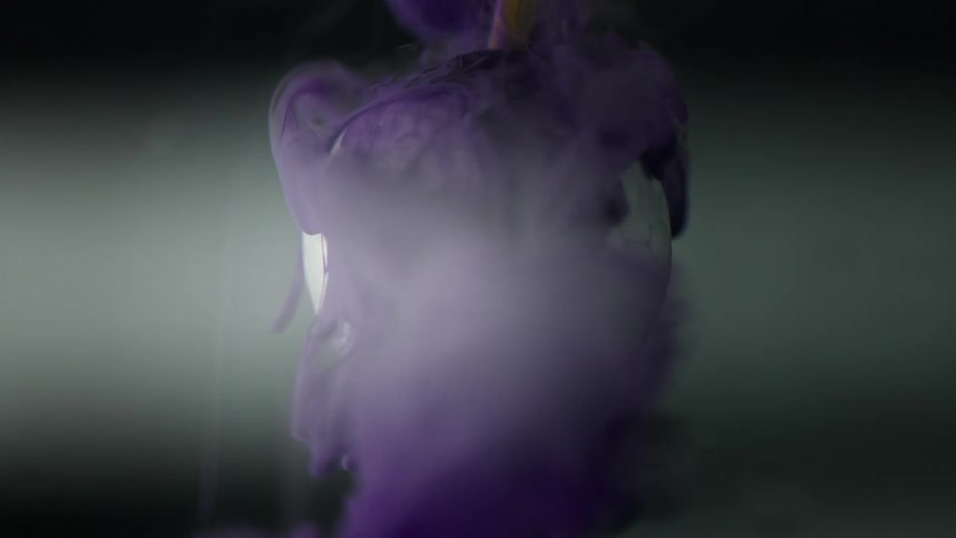 Purple clouds cover a white sphere