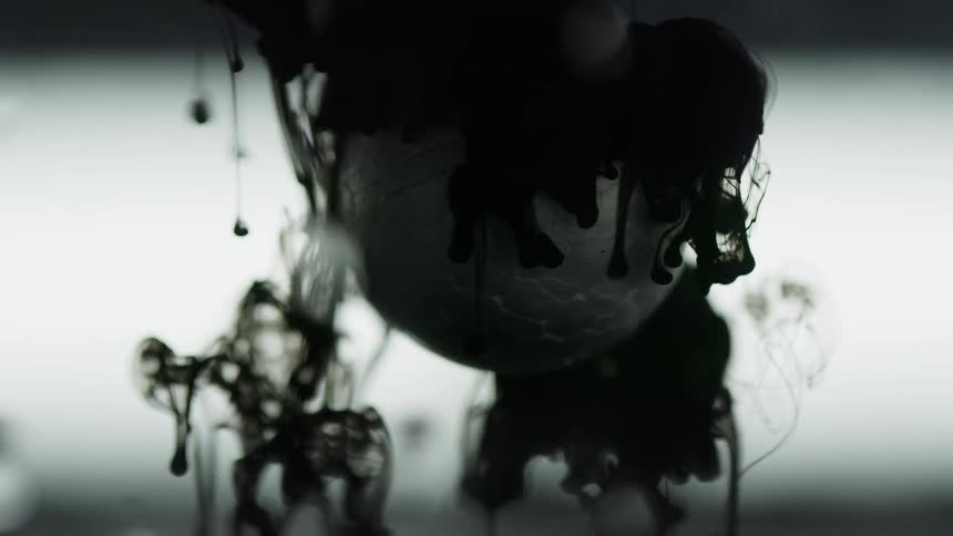Black ink flows around a sphere suspended in a tank of water