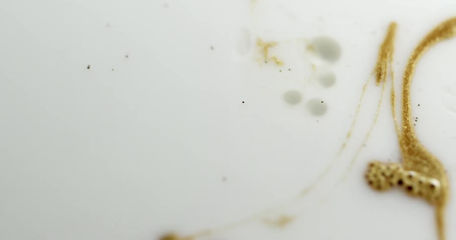 Metallic gold fills outlined shapes on white background