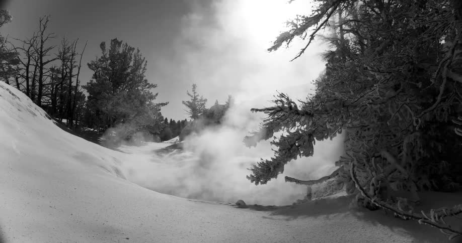 Fog over a snow covered hill