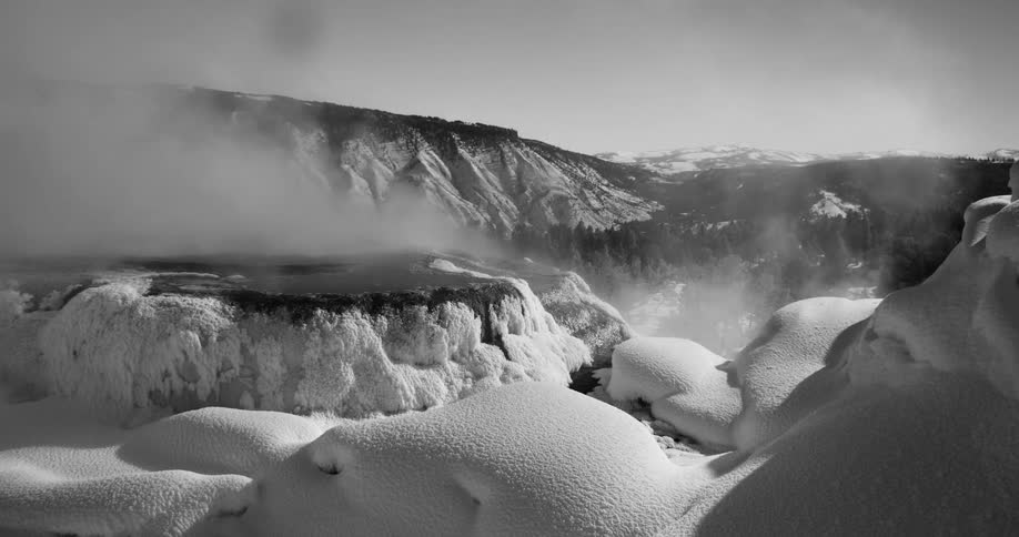 Natural thermal waters steaming in the frozen landscape