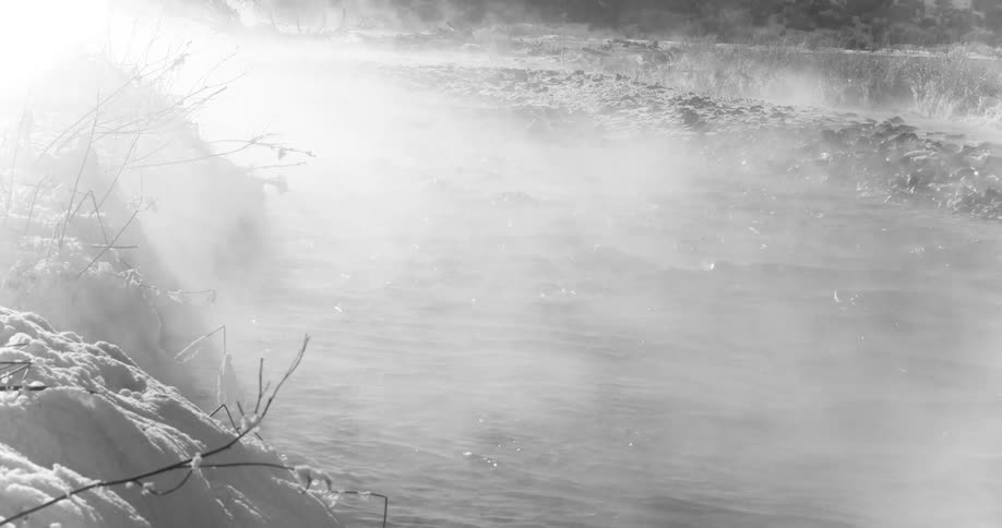 Fog rises from fast moving stream