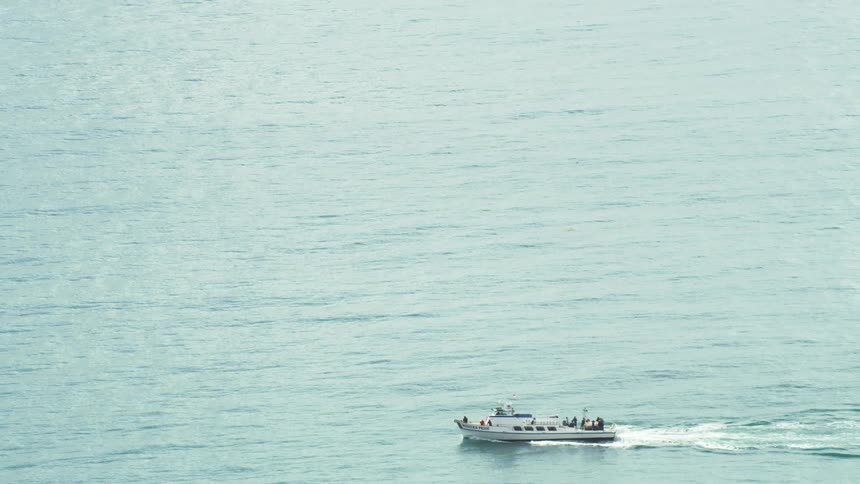 A ship is sailing in the ocean below