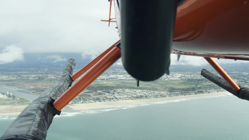 A helicopter flies over a large body of water