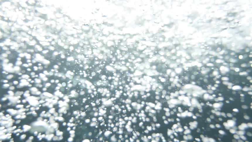 Underwater with bubbles with sunlight above